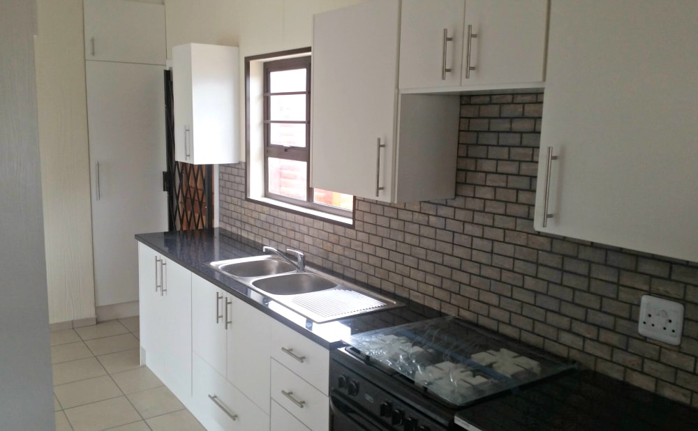 another view of the kitchen done by dkm log homs